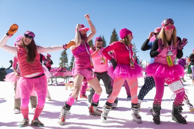 Team "revolution power yogis" dance during a snow yoga session at Vail's Wildwood Saturday during the 4th annual Pink Vail ski day to conquer cancer.  Over half a million dollars was raised by the event.